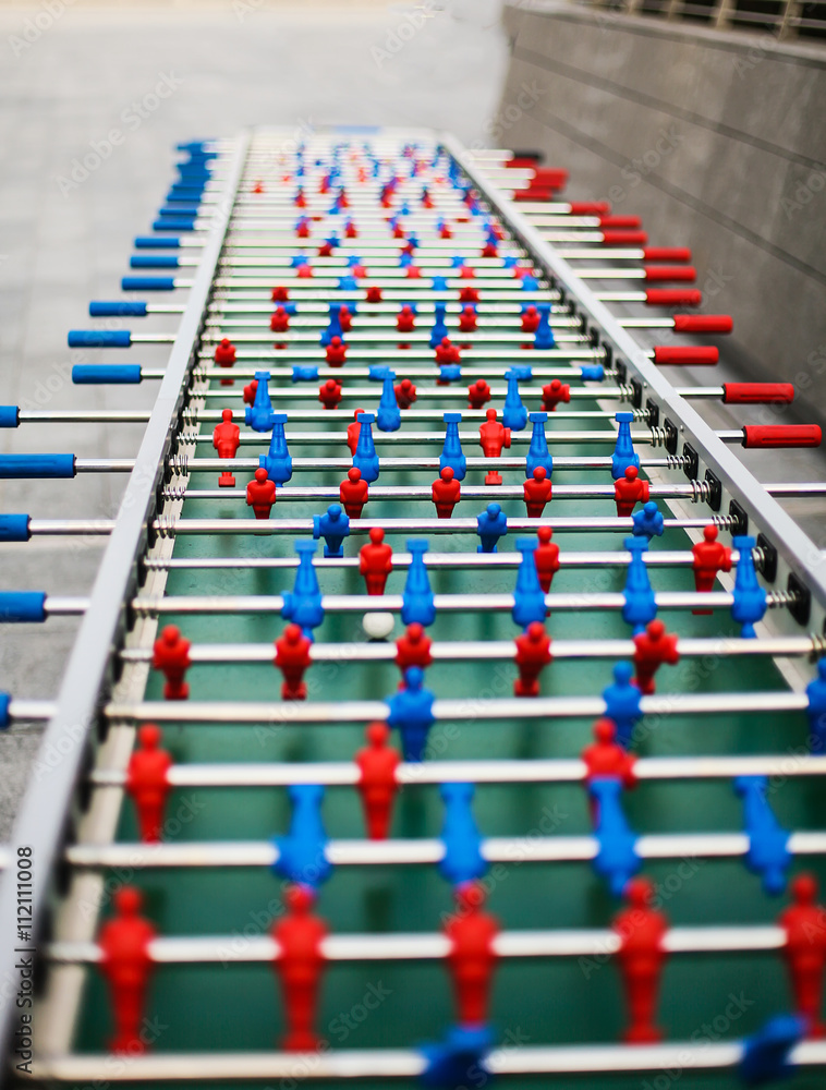 Fototapeta premium red and blue table soccer players, selective focus.