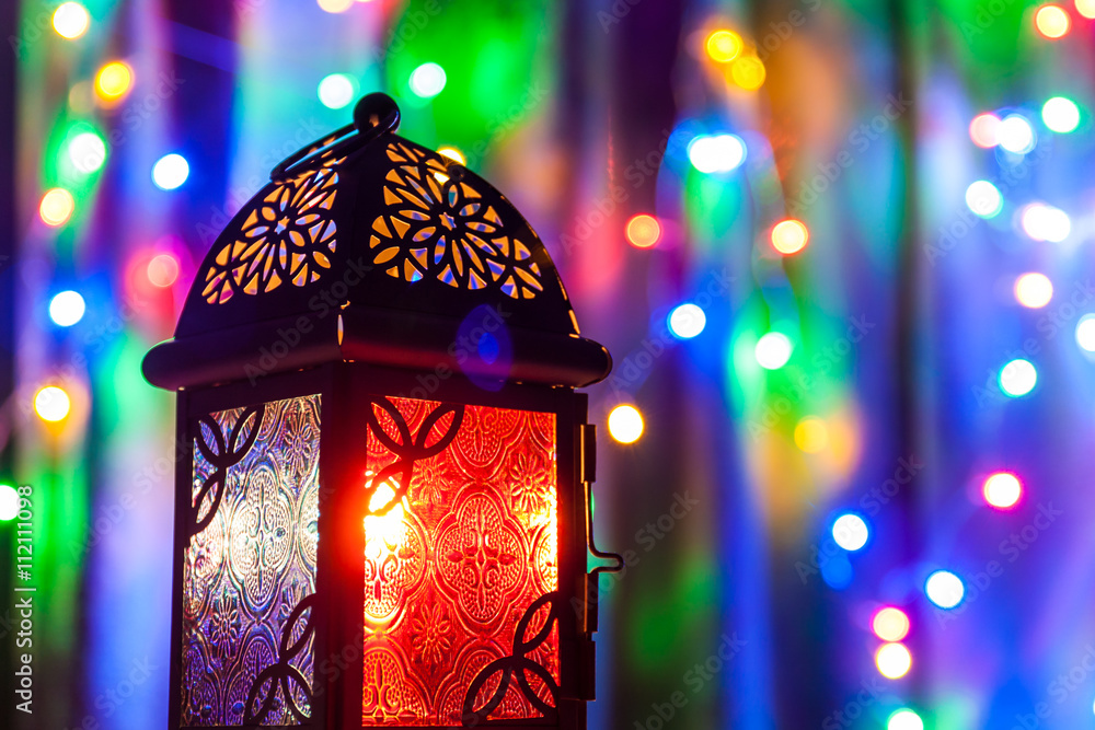 Arabic lantern on colorful light background.