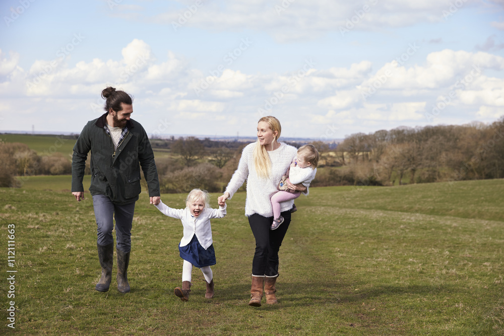 Family Holding Hands On Winter Country Walk Family Holding Hands On Winter Country Walk