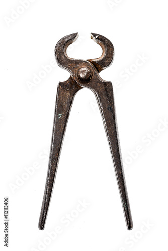 Old iron cutting pliers, tongs or nippers isolated on white.