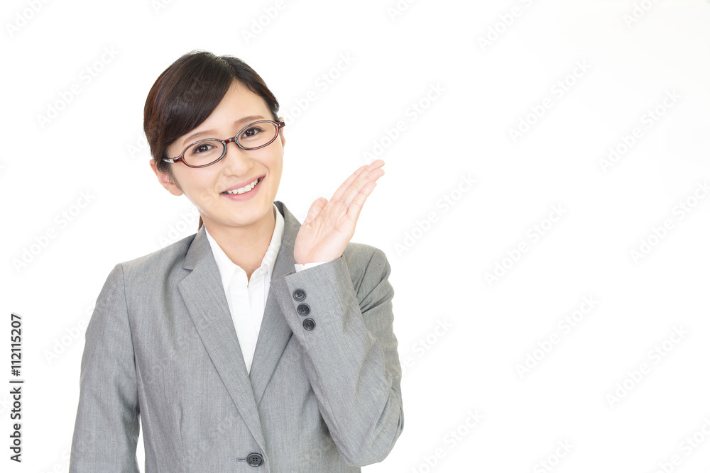 案内する笑顔のビジネスウーマン 案内する笑顔のビジネスウーマン