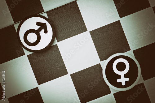 Draughts (Checkers) - husband vs wife, woman vs man, feminism vs masculism, feminine vs masculine. Conflict and fight between genders and heterosexual couples photo