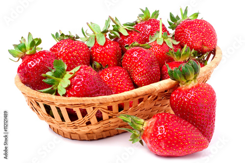 strawberries in a wicker basket isolated on white background