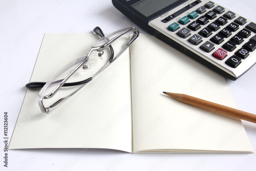 Calculator, notebook, eyeglass and pencil Calculator, notebook, eyeglass and pencil