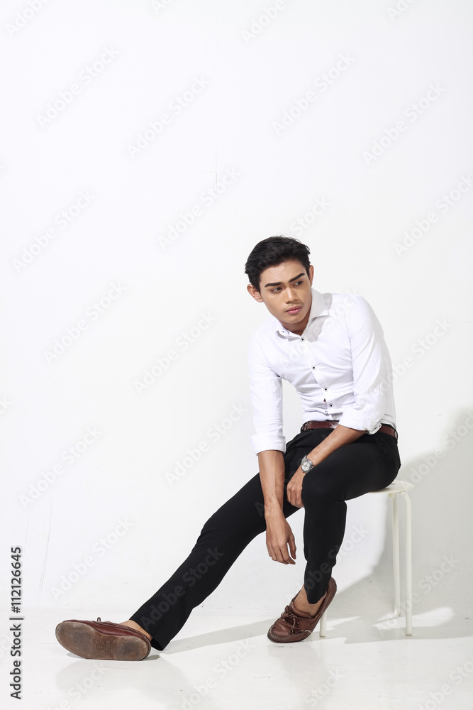 asian man posing on white wall asian man posing on white wall