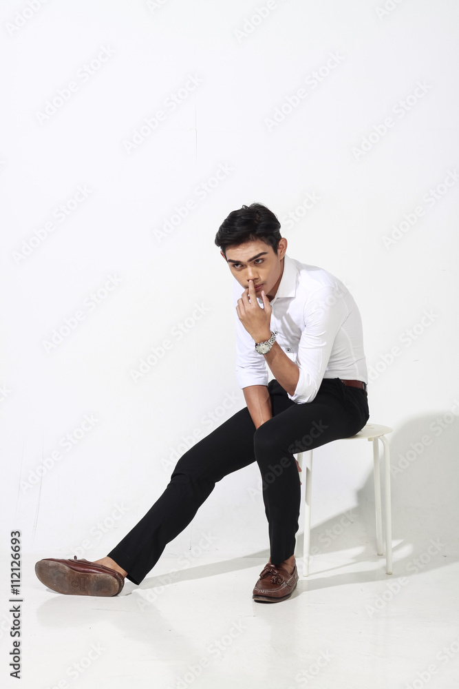 asian man posing on white wall asian man posing on white wall