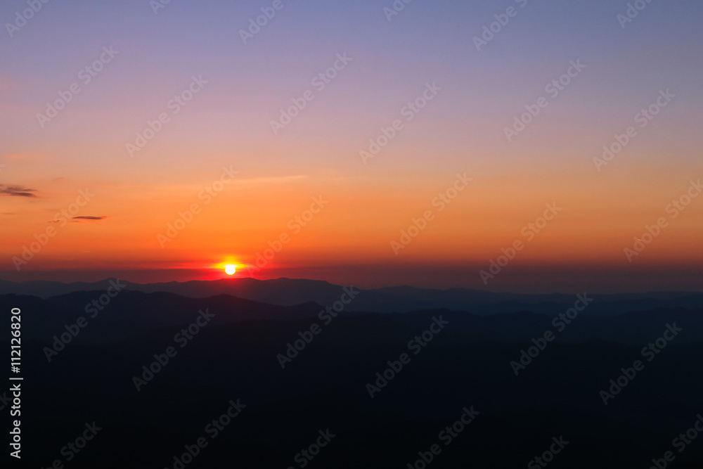Mountain valley at sunset time. Sunset at mountain top. Twilight