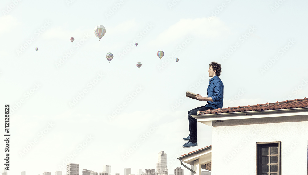 Fototapeta premium Young man with book
