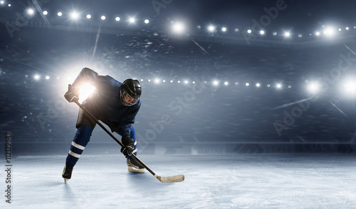Ice hockey player at rink © Sergey Nivens