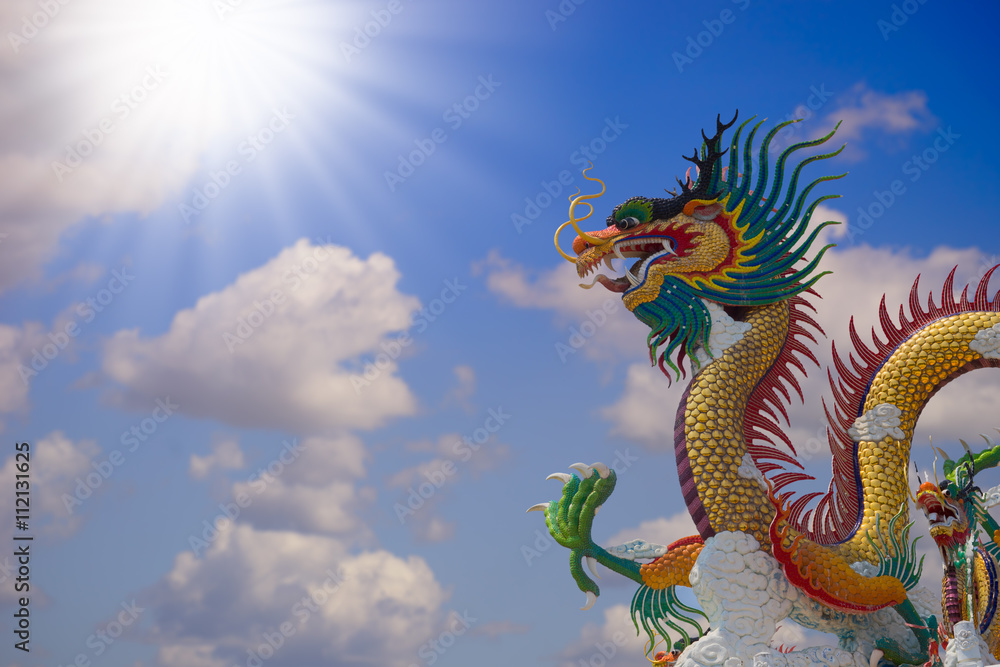 Fototapeta premium beautiful chinese dragon with blue sky background at thailand
