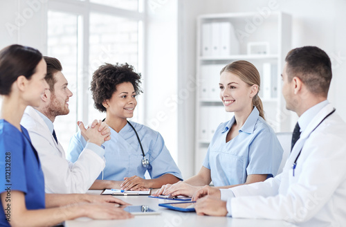 group of happy doctors meeting at hospital office