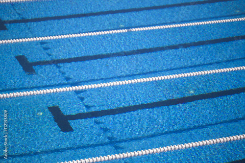 Photography of lanes of a competition swimming pool with water