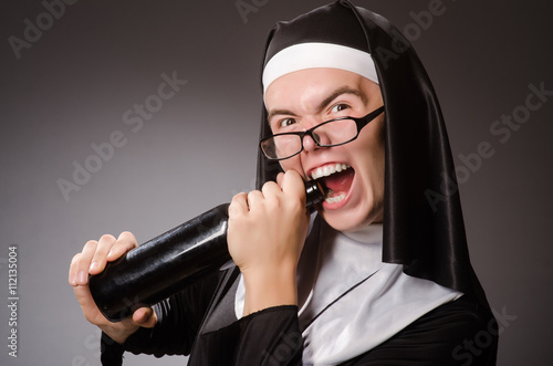 Fotografie Funny man wearing nun clothing