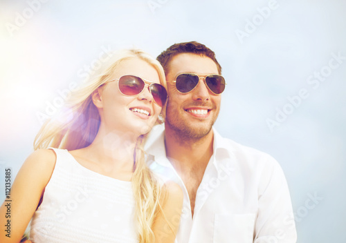 happy couple in sunglasses
