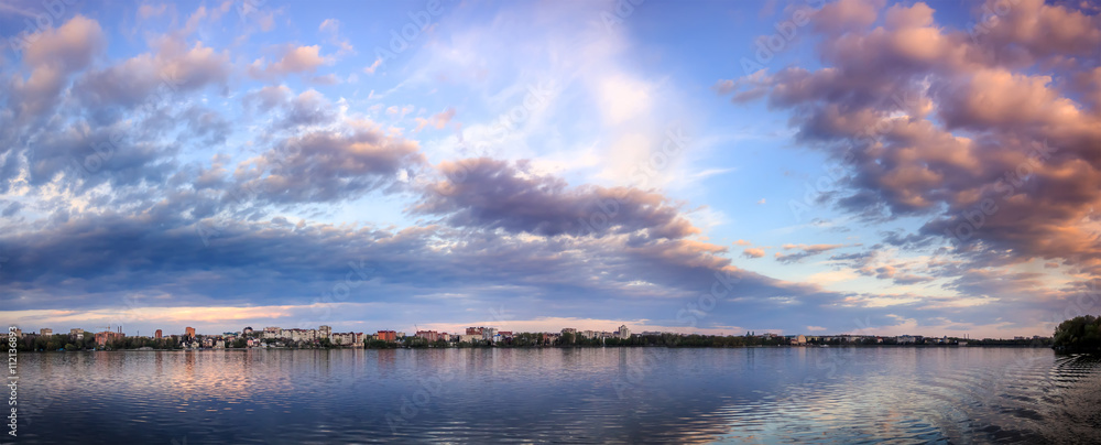 Fascinating Landscape. Majestic sunset. dramatic colorful clouds over the lake, reflected in the water. wonderful view. use as background. color in nature. series. toned