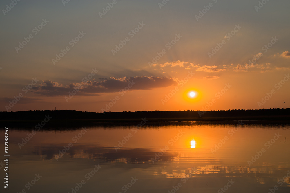 orange sunset reflected in water