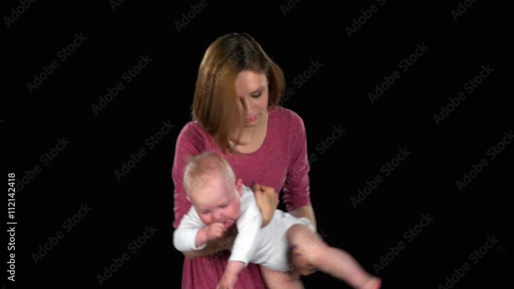 Family mother and a small child playing. Black Family mother and a small child playing. Black