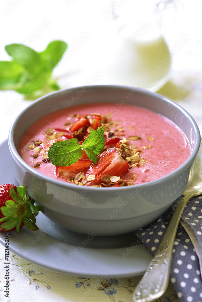 Strawberry oat smoothie in a gray bowl . Strawberry oat smoothie in a gray bowl .
