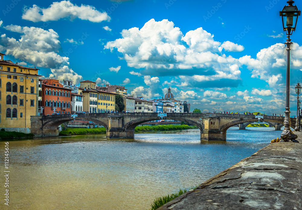 Florence Italy famous bridge view./ View on cityscape of Florence, touristic place in Italy, Europe.