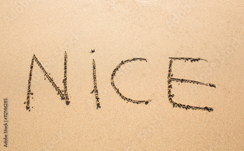 Nice Word Written On Sunny Summer Beach Sand