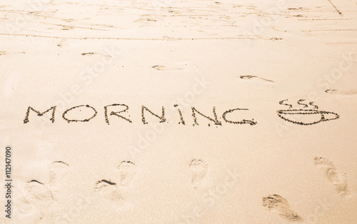 Abstract hand writing on the sand word Morning