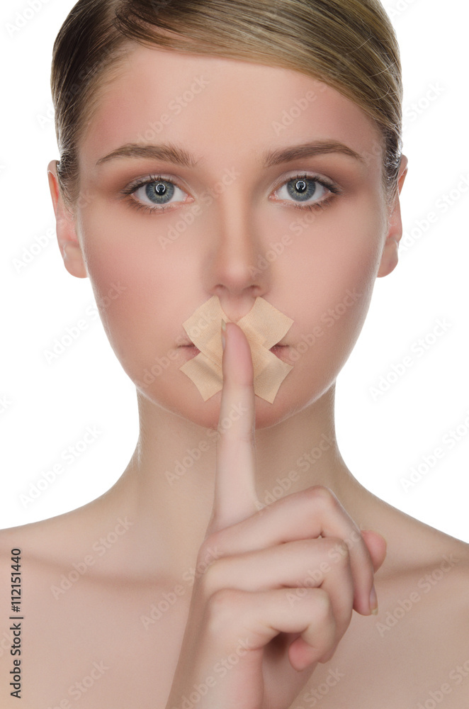 face of beautiful woman with plaster and finger face of beautiful woman with plaster and finger