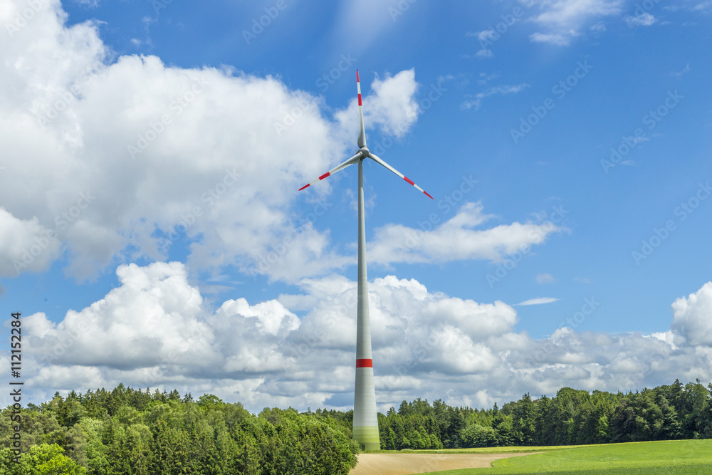 Fototapeta premium Single wind turbine in the field in rural area in Bavaria
