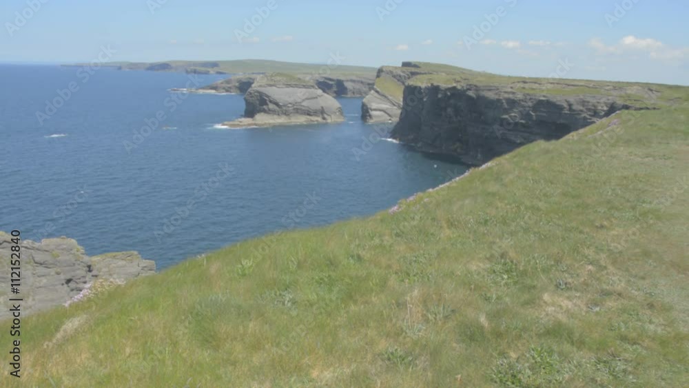 Loop Head Peninsula,West Clare,Ireland showing rocks and cliffs sculpted by the Atlantic Ocean. Wild Atlantic Way Route. Flat video profile. Loop Head Peninsula,West Clare,Ireland showing rocks and cliffs sculpted by the Atlantic Ocean. Wild Atlantic Way Route. Flat video profile.