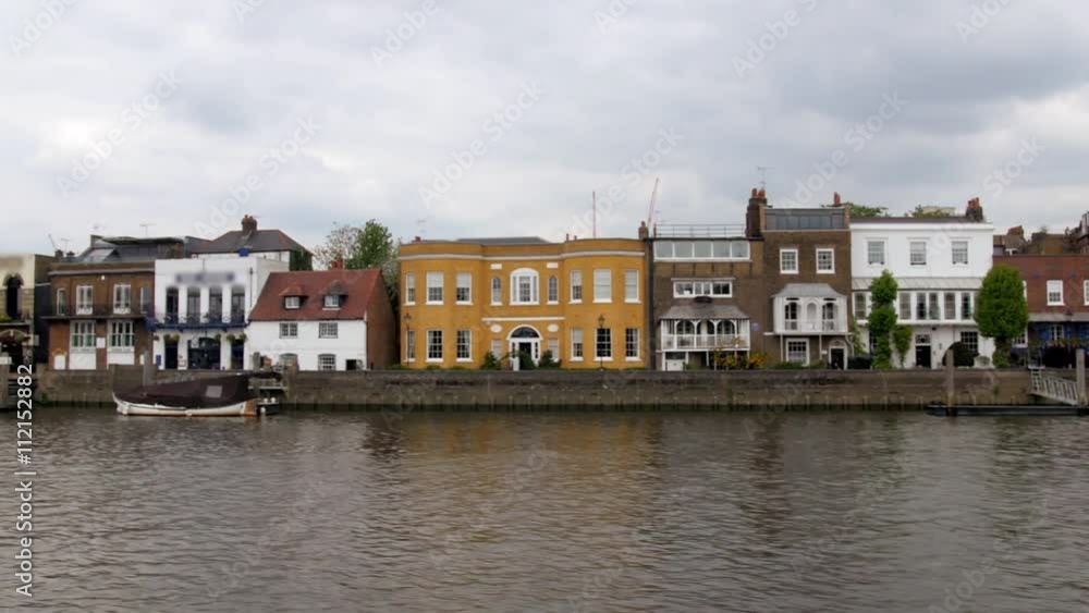 Dolly view of a typical English riverside village in West London Dolly view of a typical English riverside village in West London