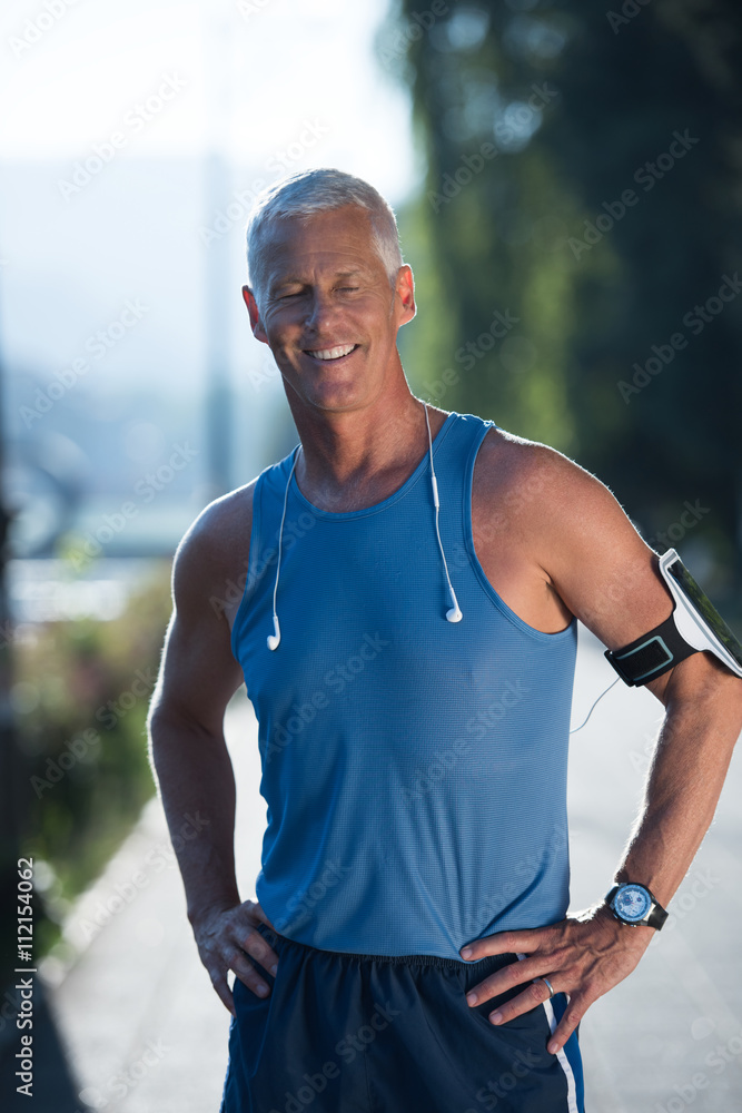 portrait of handsome senior jogging man