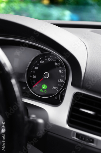 Illuminated dashboard in the eco car.Concept of alternative eco energy © Africa Studio