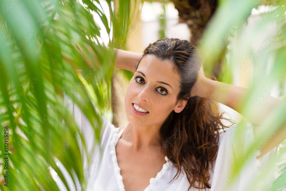 Wellness and beauty concept. Natural woman portrait at tropical garden. Tranquil female on summer vacation. Wellness and beauty concept. Natural woman portrait at tropical garden. Tranquil female on summer vacation.