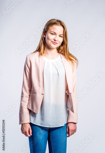 Girl in jeans and pink jacket, woman, studio shot