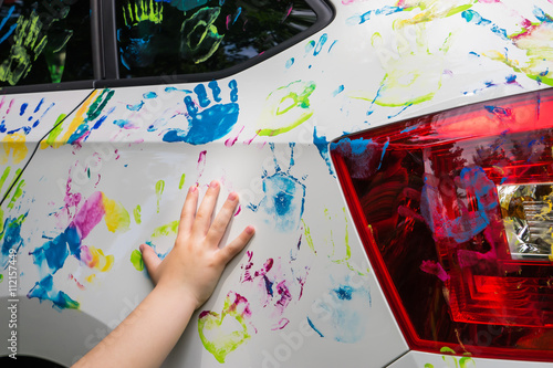 Little girl with colorful car