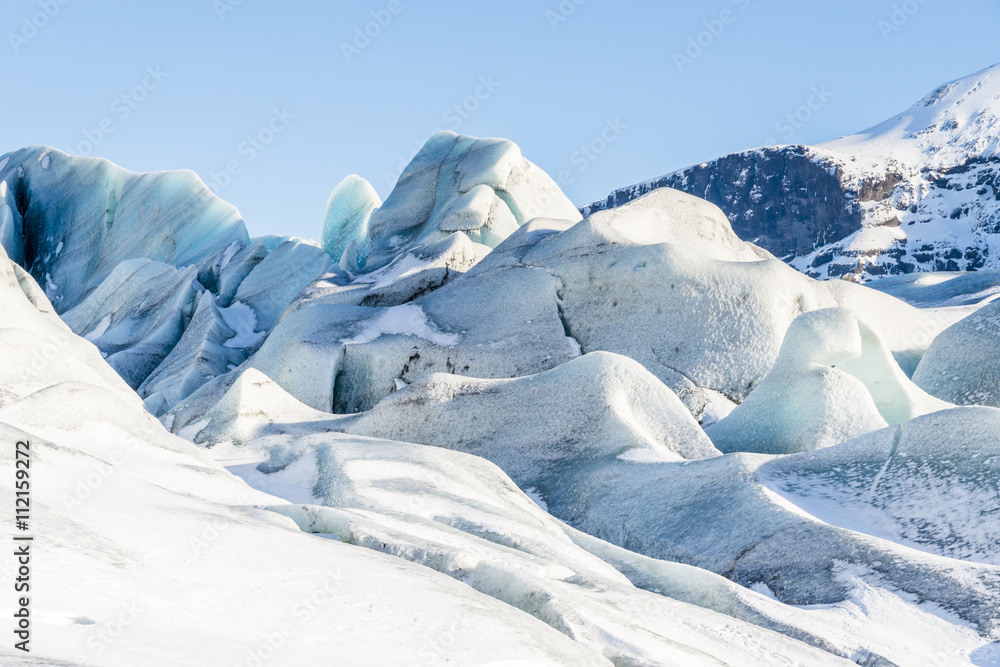 Amazing huge ice floes in Svinafellsjokull glacier near Hofn. Skaftafell. Vatnajokull National Park. Iceland in winter Amazing huge ice floes in Svinafellsjokull glacier near Hofn. Skaftafell. Vatnajokull National Park. Iceland in winter