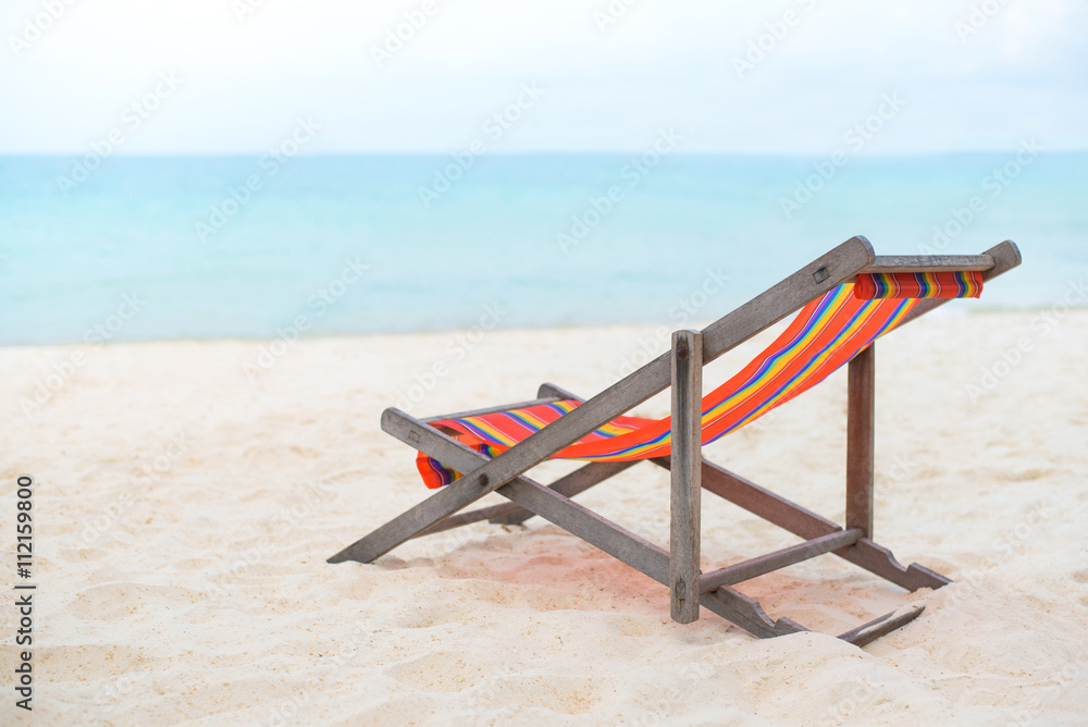 beach chair on the sand beach with sea and blue sky