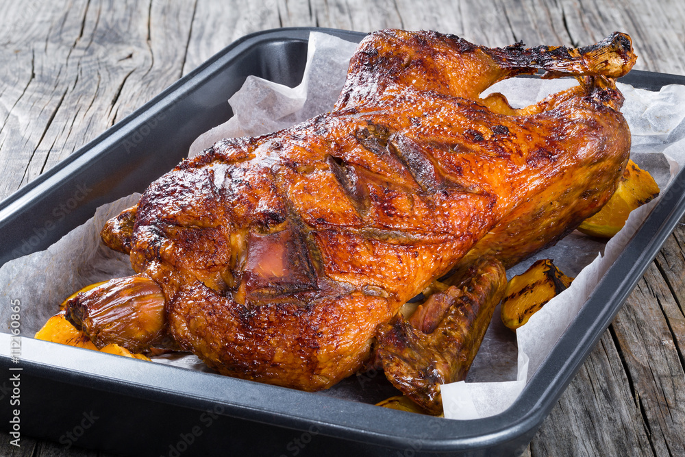 Fototapeta premium Roasted Whole Duck in a baked dish, closeup