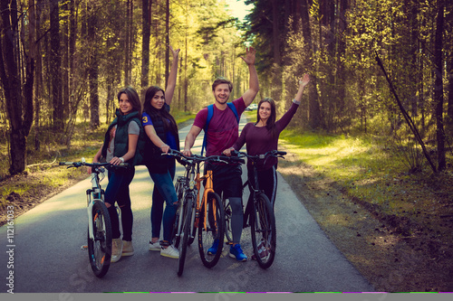 Group of adult having fun with bicycles.
