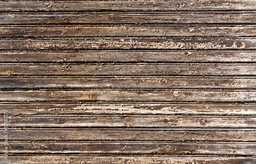 Weathered wooden house wall texture.