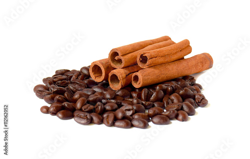 Several sticks of cinnamon and coffee beans.