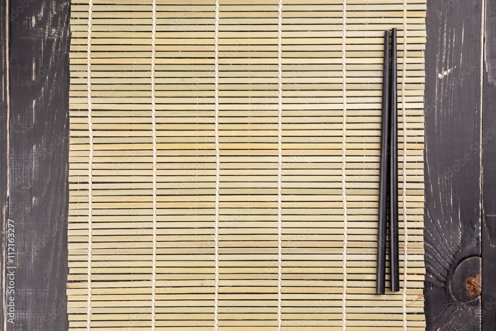 Fototapeta Background with two sushi chopsticks