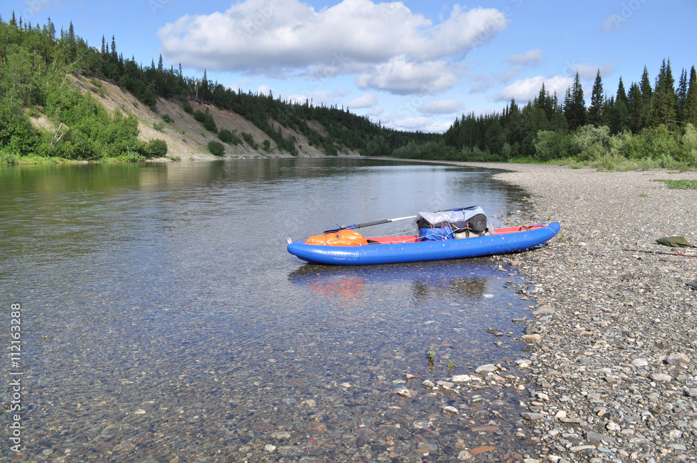 Inflatable kayaks on the shore taiga rivers. Inflatable kayaks on the shore taiga rivers.