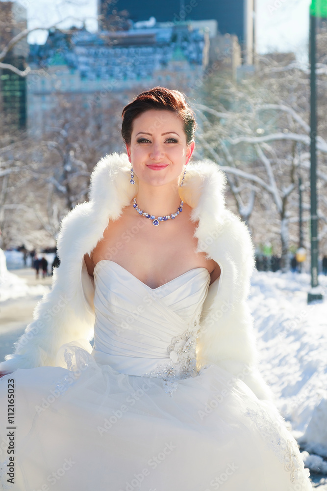Bride in the winter against the backdrop of New York Bride in the winter against the backdrop of New York