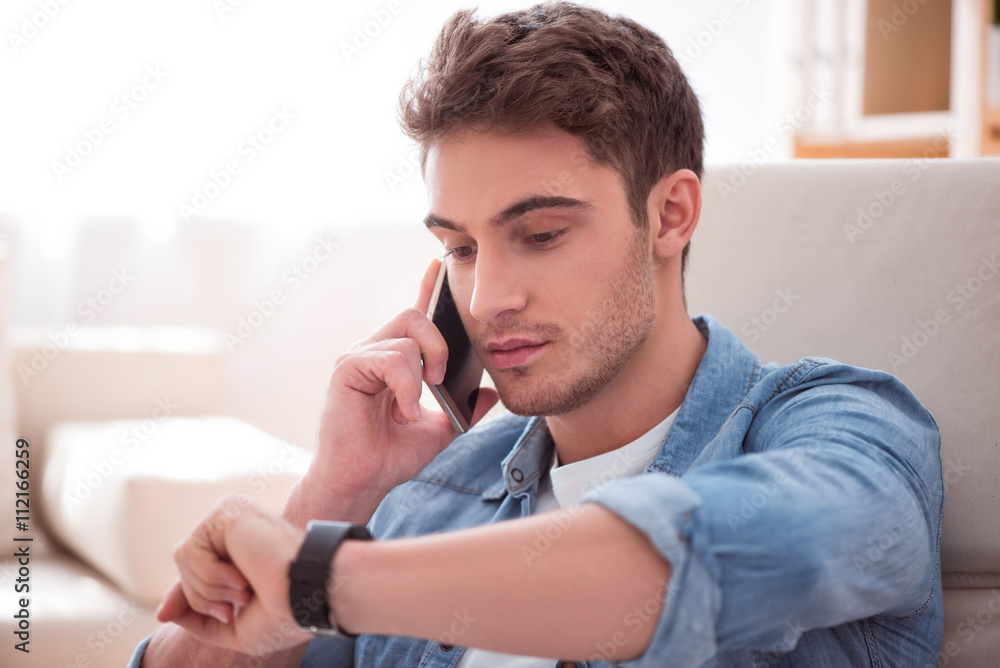 Pleasant handsome man talking on cell phone Pleasant handsome man talking on cell phone