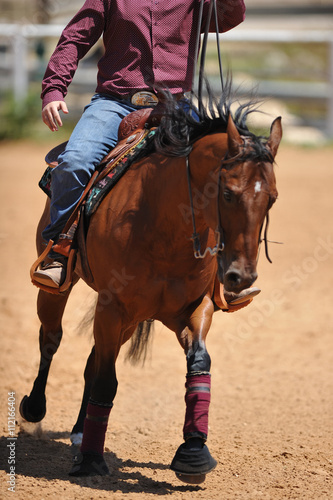 The rider on horseback galloping ahead