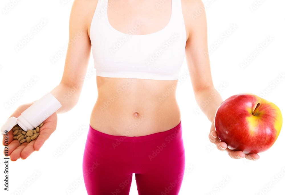 Woman holding vitamins and apple. Health care. Woman holding vitamins and apple. Health care.