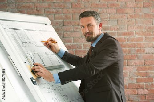 Engineer working with bluep...