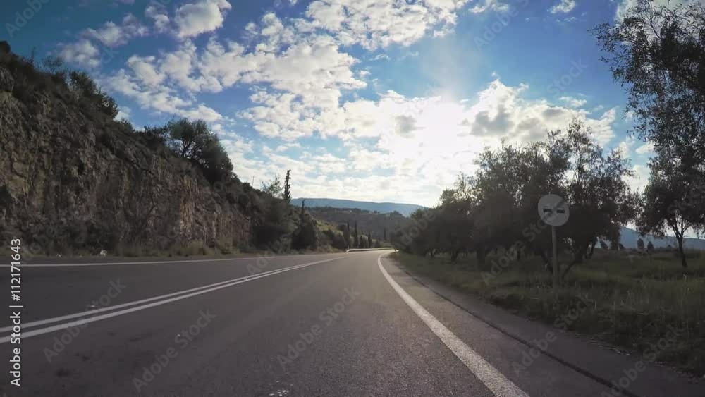 Vehicle car drive countryside road olive groves trees plantation point of view Greece Vehicle car drive countryside road olive groves trees plantation point of view Greece