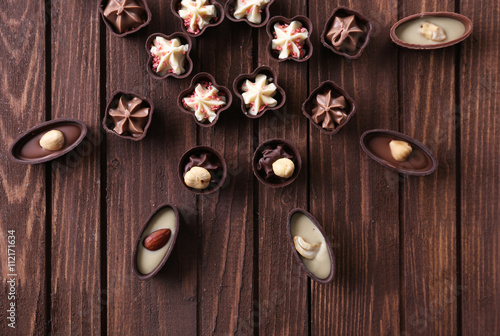 Chocolate sweets on wooden background