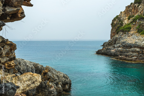 Turquoise sea bay with cliff in Turkey, Mediterranean region photo